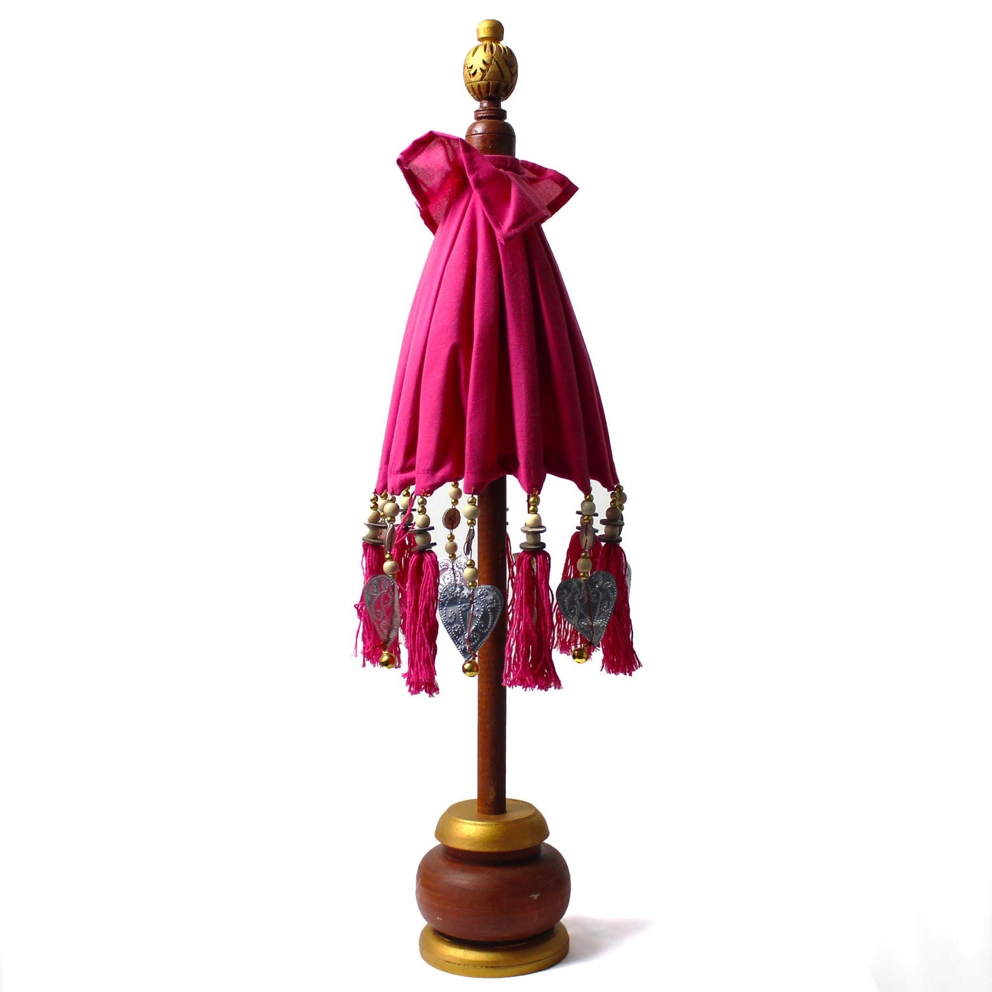 Zijaanzicht van roze katoenen Bali-parasol met kwastjes en houten handvat, 68 cm hoog, vrolijk tropisch woonaccessoire
