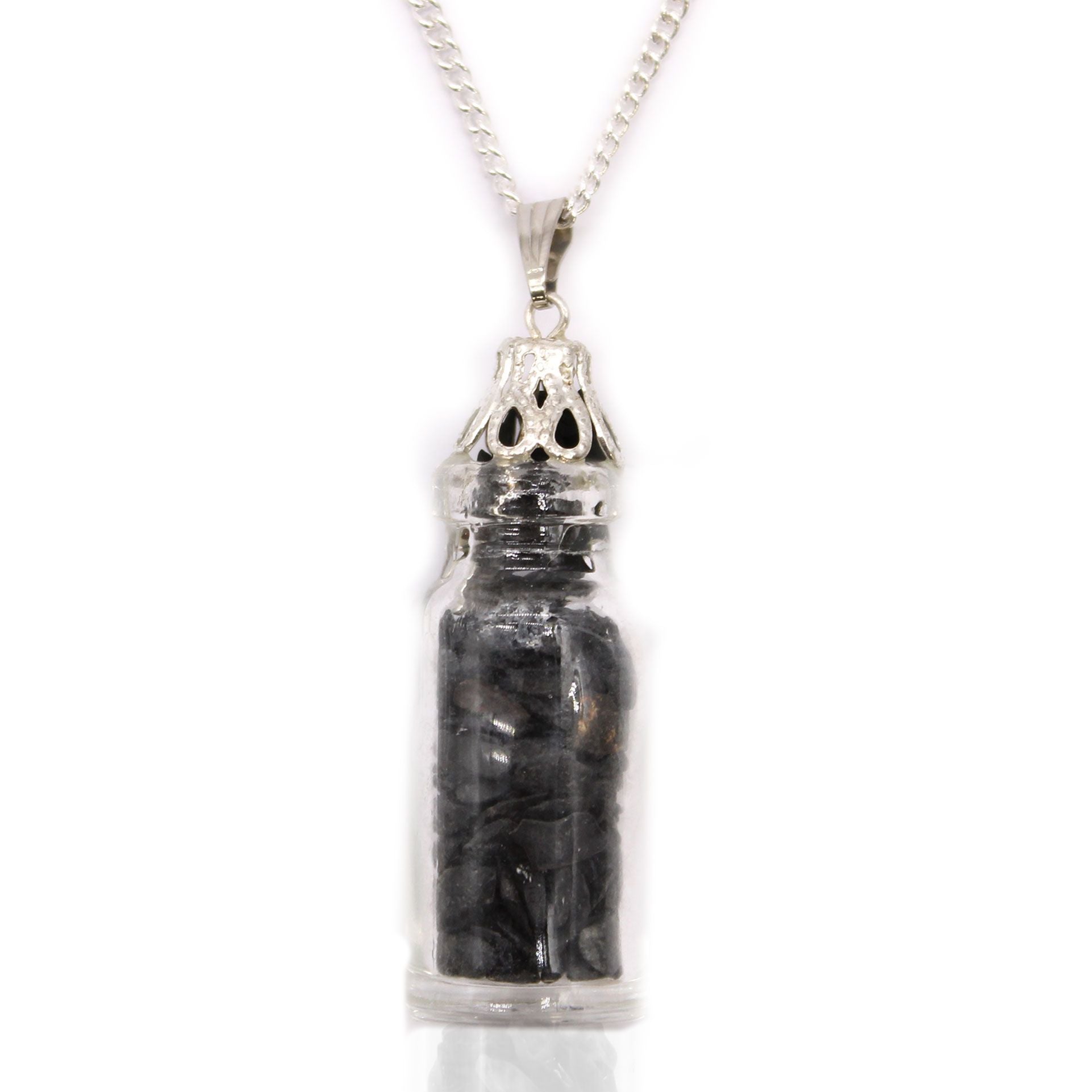 Zwarte onyx edelstenen ketting met echte kristallen stukjes verzegeld in een glazen flesje aan een verzilverde ketting