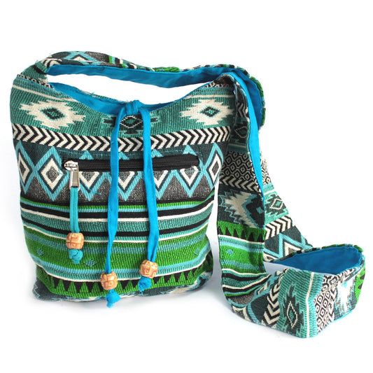 Handgeweven Nepalese jacquard sling bag in levendig blauwgroen met traditioneel etnisch patroon en crossbody riem

